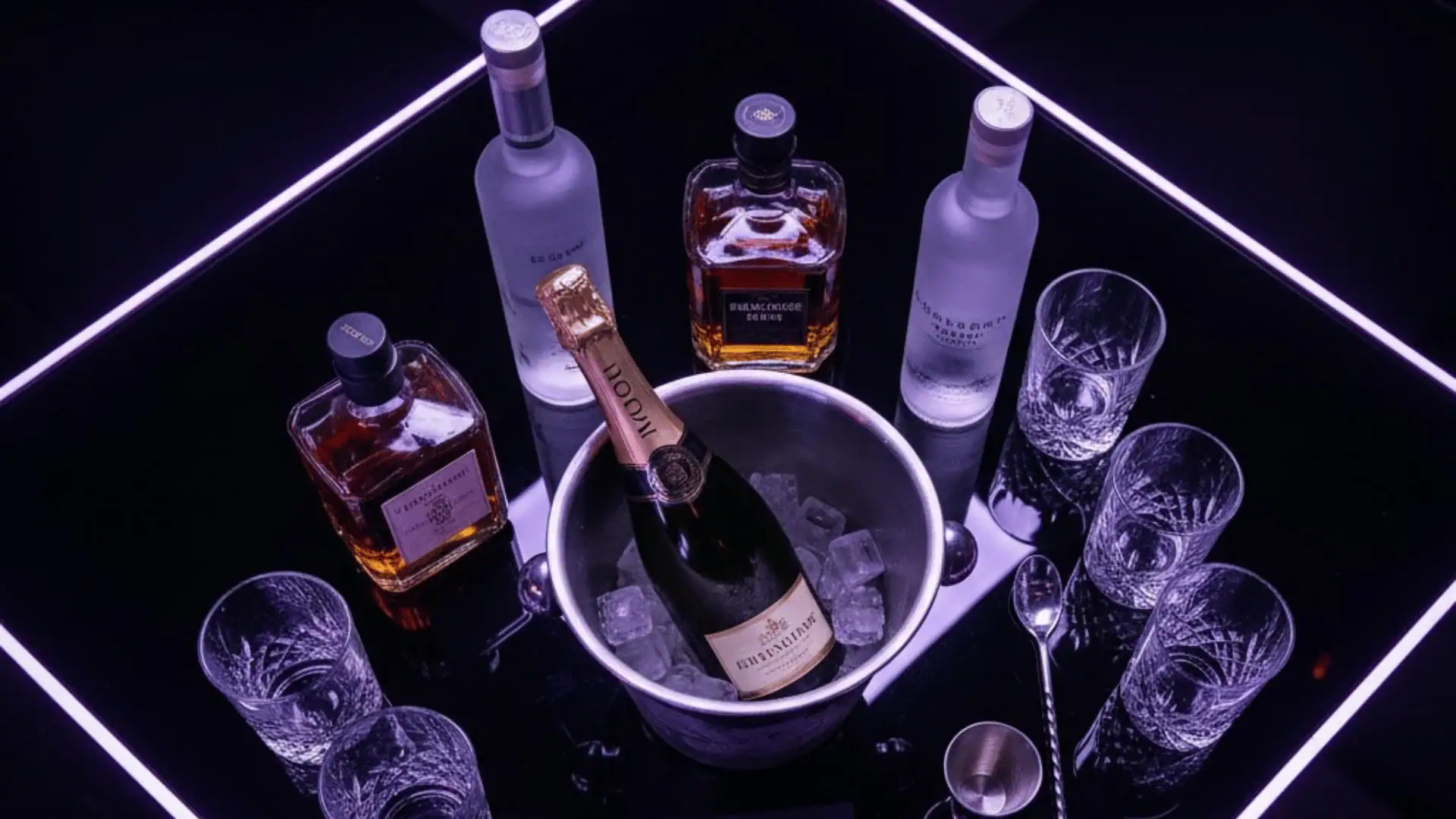 Champagne and whiskey bottle display on a luxury bar setup at Atlantis of NYC in Jamaica, NY